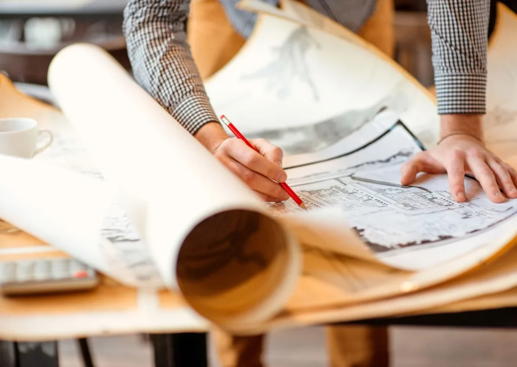 Man Designing a Project Blueprint
