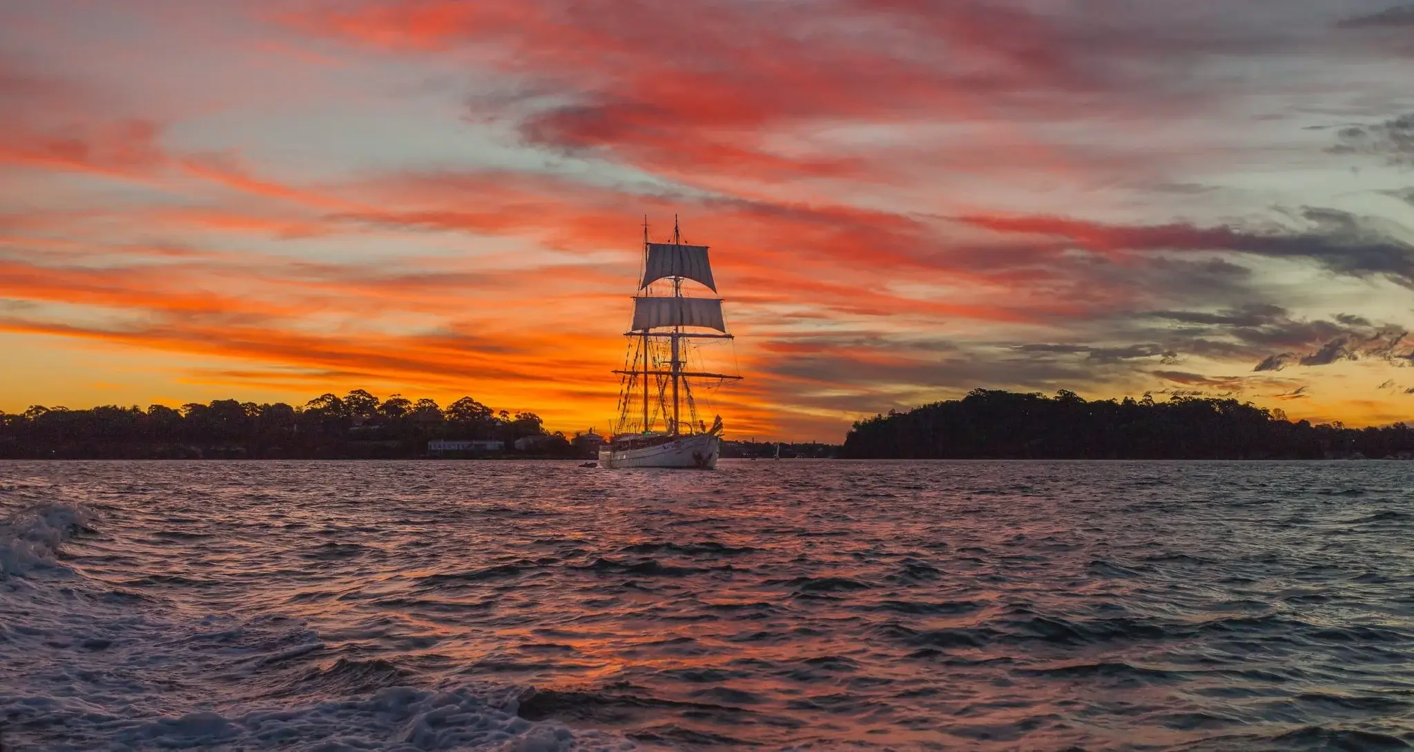 White Boat Sailing on Sunset