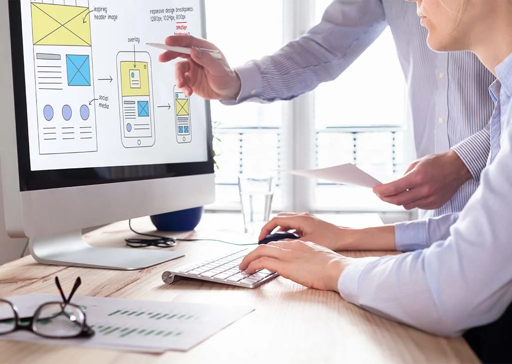 Two People Working Together on Computer