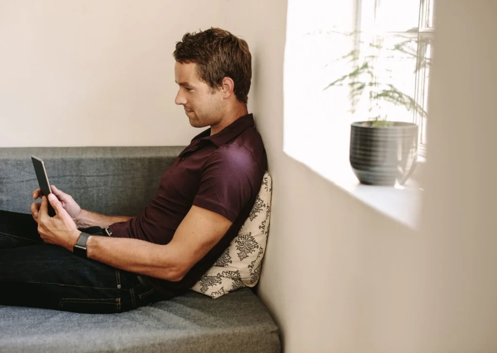 Man reads phone. What has changed on LinkedIn from last time I logged on? We go through the changes.
