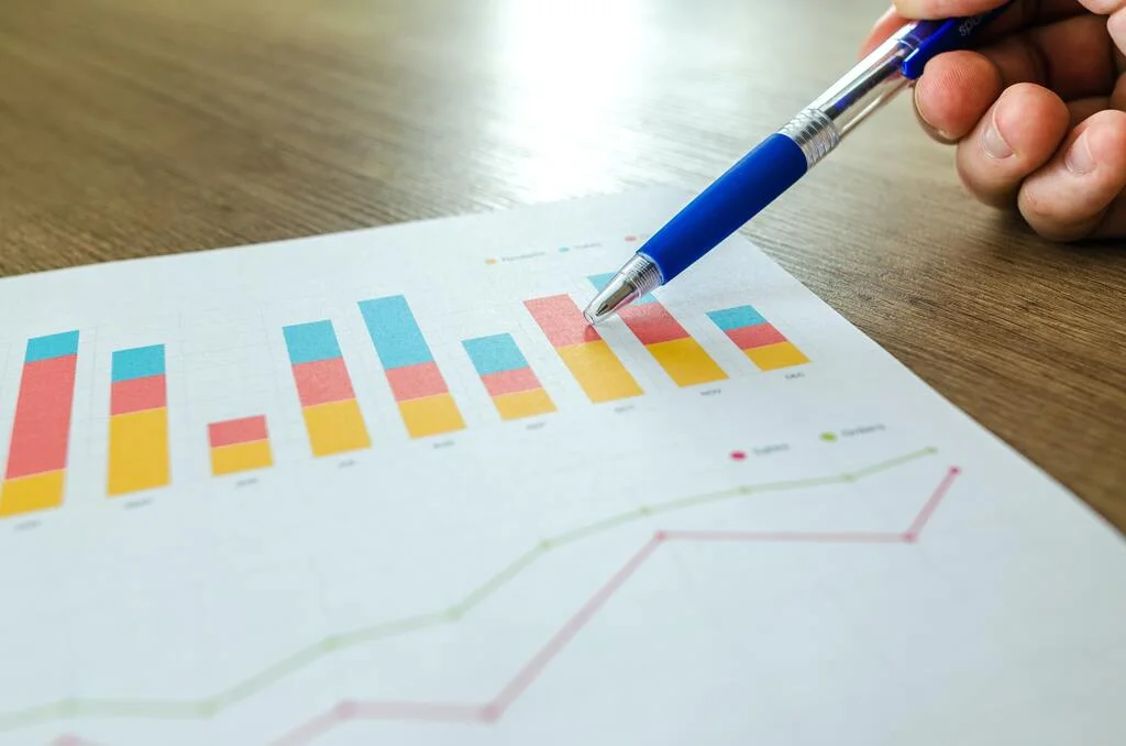 Pen Pointing at Data Sheet Charts